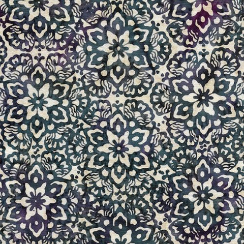 This batik is a white and navy geometric floral design. This batik is not directional. There are hints of purple in the navy that add a little bit extra depth.