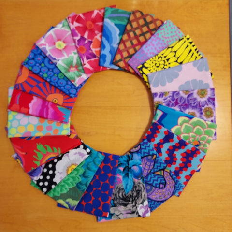This fat quarter bundle is from FreeSpirit and contains 20 mystery fat quarters. 100% cotton, each fat quarter measures 18" x 21". Fabrics include different Kaffe Fassett fabrics