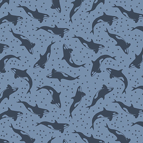 A toss of diving navy orcas and tiny hearts on a blue background. From the Polar Plungers Collection by Beth Reed for Studio E. 100% Cotton, 44/45" wide.