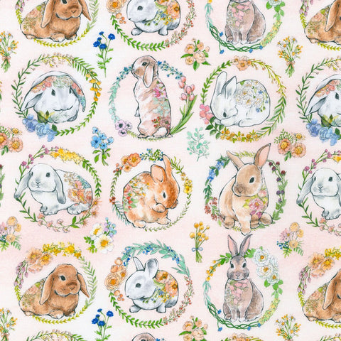 This adorable fabric is covered in different bunnies surrounded by flowers. This white background has some blush spots around it and some little flowers in between each bunny.  Lightweight fabric with a very soft hand. 