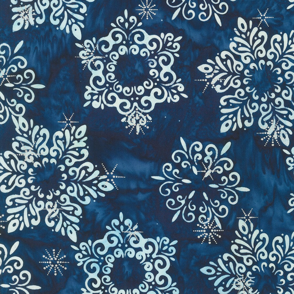 This fabric is a beautiful batik that is a deep navy blue color with white snowflakes tossed all over. 100% Cotton, 43/44in