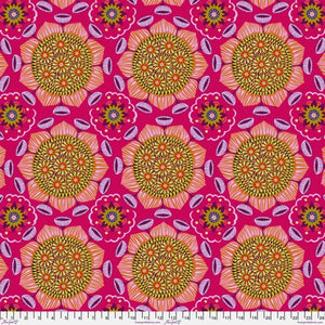 Bright and fun floral from Freespirit designed by Anna Maria. This fabric has large kaleidoscope style flower with a green gold center and pink and purple petals. There are also some purple flowers that are sticking out of the main flower petals. This fabric is so interesting to look at! 
