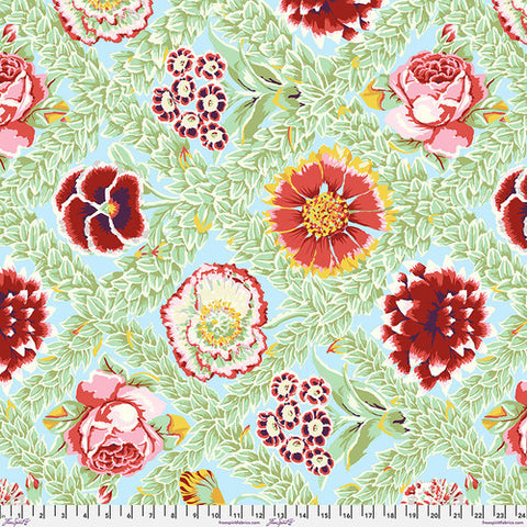 Vintage collection by Kaffe Fassett for Freespirit Fabrics. This bright fabric is from Kaffe Fassett and is full of blues, greens, pinks, reds and whites. Pastel colored blue background with green leaves and bright red flowers. 