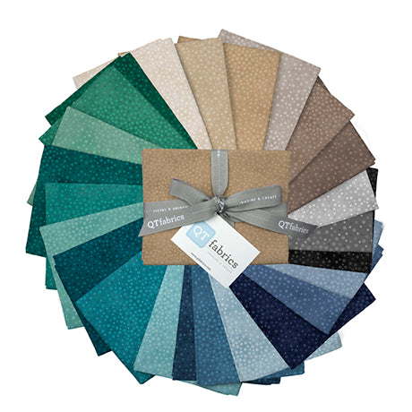 Add depth, dimension, and vivid color to any project with QT’s newest blender – Spotsy!. Meandering polka dots on a shadedl ground are available in 126 colors running the color gamut in brights, dusty, to neutral combinations. Select colors available in 108” wide width. ©QT Fabrics