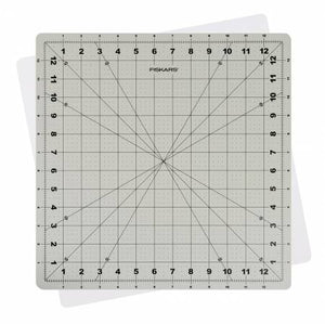 Our Rotating Cutting Mat makes squaring off large quilting blocks up to 12.5in or cutting out appliqué quicker and more convenient. It features a self-healing mat with an easy-to-read measuring grid, plus bias lines to make accurate shape cutting hassle-free.