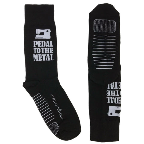 Black with white lettering.  Super soft, one size fits most socks. Made from 75% cotton, 23% nylon, and 2% spandex.