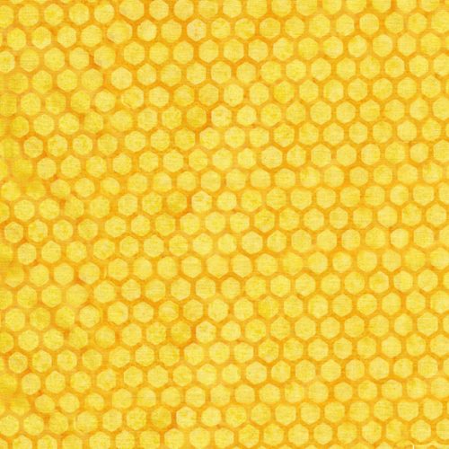 This batik is a rich yellow color with honeycomb print on top. The honeycomb design is a little bit darker than the background to give it that depth. 