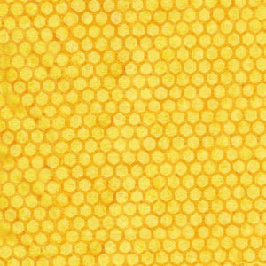 This batik is a rich yellow color with honeycomb print on top. The honeycomb design is a little bit darker than the background to give it that depth. 