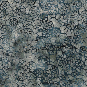 This batik is grey blue and smokey navy. The fabric is a lot lighter in person with the background being a green, grey with blues throughout and navy prickly pear cactus design on top. 