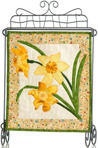 Sure to give you cabin fever, wishing for warmer days...  Think SPRING! with this pattern to create a quilted applique wall hanging featuring a floral design- perfect spring decor.  This mini, quilted wall hanging is a great project for beginners.  It features a classic flower- daffodils.  Have fun creating this easy applique project.
