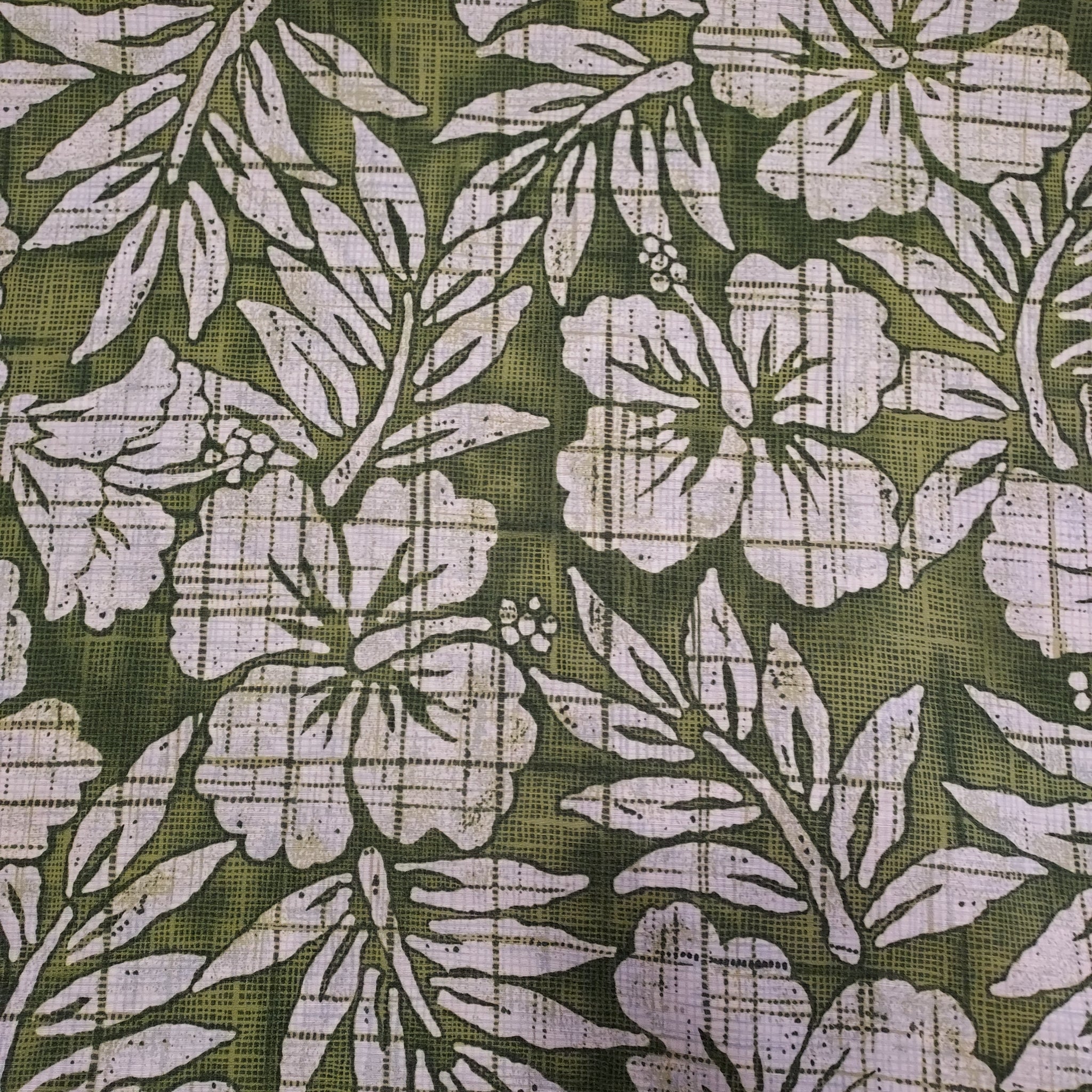 This fabric would make the best hawaiian shirt!  ©Kahala fabric it is full of island inspiration with white hibiscus flowers and leaves over a green background. Bringing back the 2000s island vibe! Make your next summer outfit with this pretty fabric.   100% Rayon  44"