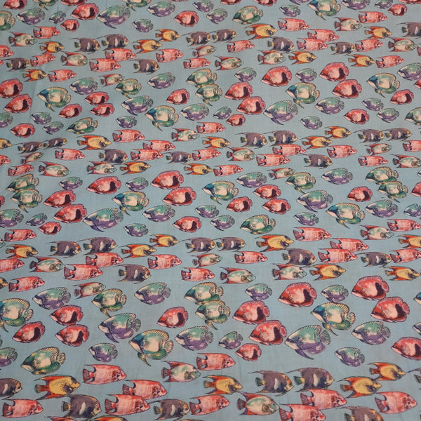 Fishy printed cotton. Thin enough to be considered cotton lawn, but can also be used for quilting. Would be great for pajamas or a light beach cover. Colorful fish on a bright blue background.   100% Cotton  44"