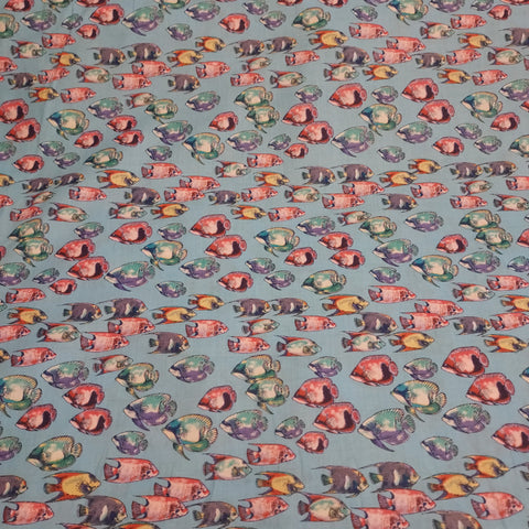 Fishy printed cotton. Thin enough to be considered cotton lawn, but can also be used for quilting. Would be great for pajamas or a light beach cover. Colorful fish on a bright blue background.   100% Cotton  44"