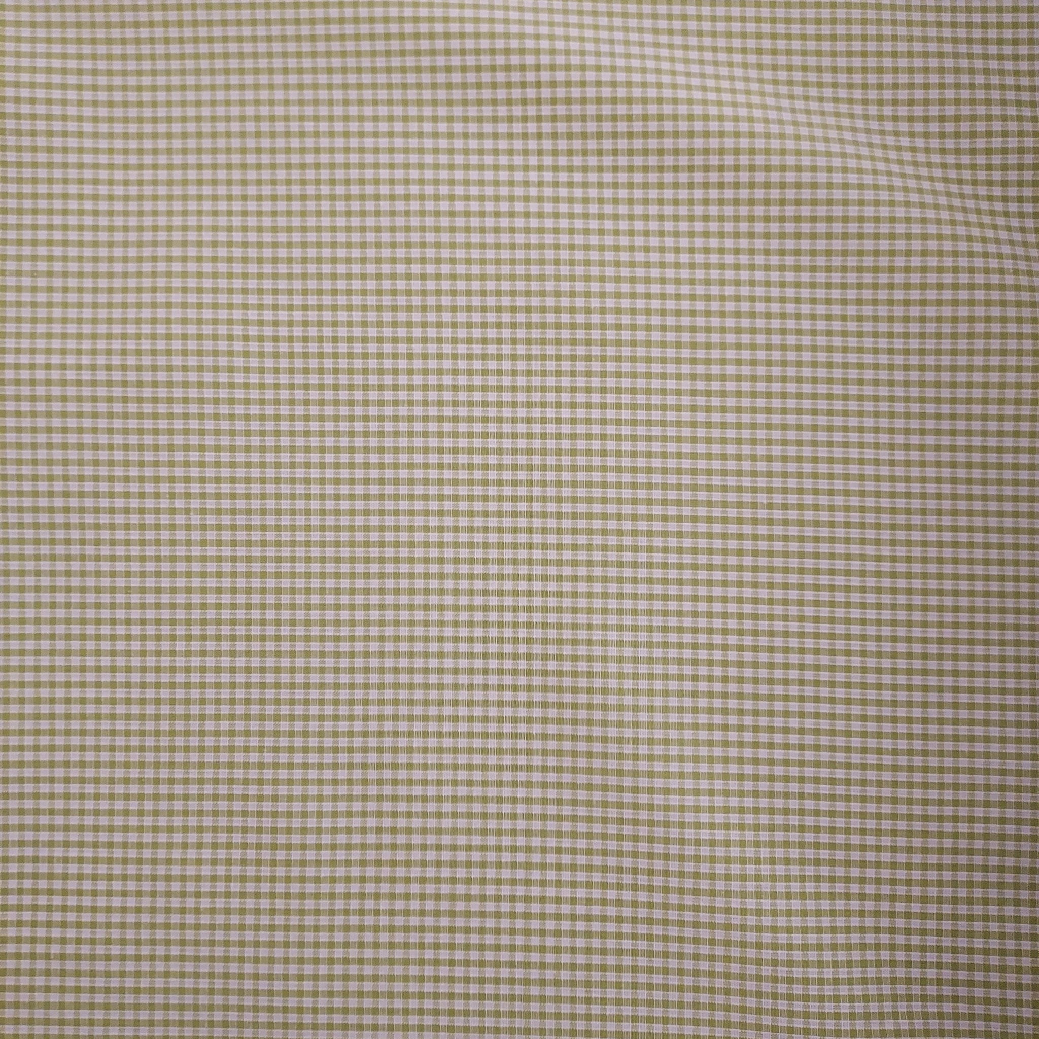 This adorable gingham is in a bright green with white. There is a nice texture to this fabric since it is a woven pattern. Perfect for clothing or decorations.   100% Cotton, 60" wide