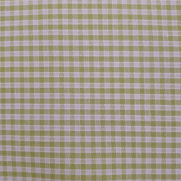 This adorable gingham is in a bright green with white. There is a nice texture to this fabric since it is a woven pattern. Perfect for clothing or decorations.   100% Cotton, 60" wide