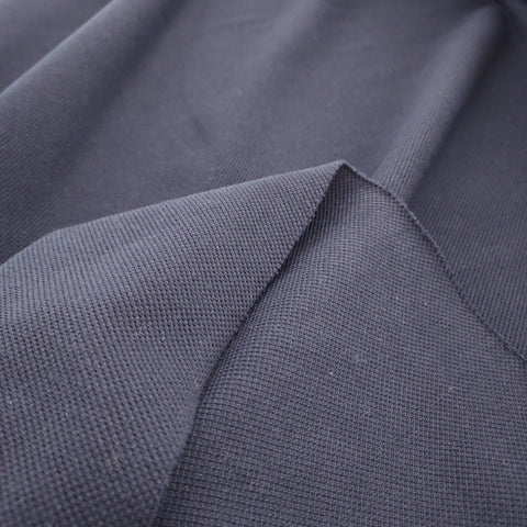 This navy pique knit is the perfect material to make a polo shirt or dress!! Super soft cotton with a nice texture. Dark navy color 