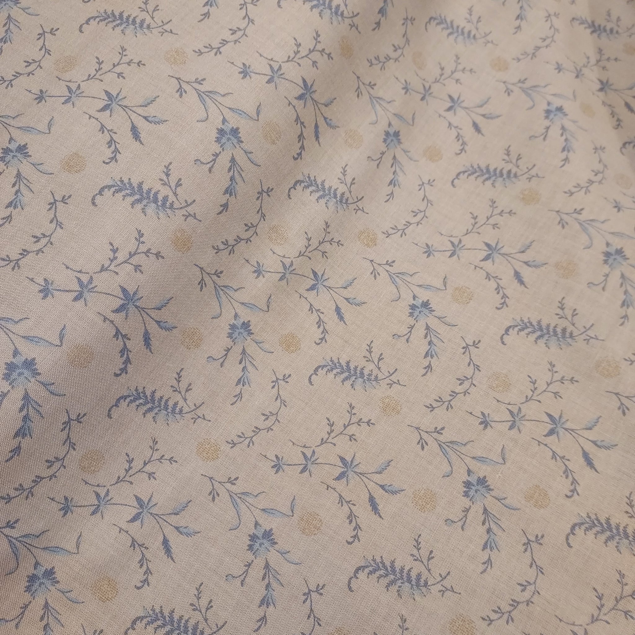  This beautiful cotton fabric is made in Japan. Super soft hand and lightweight feel, this fabric has blue ferns and leaves on it as well as small tan dots. Beautiful fabric for clothing or quilting.