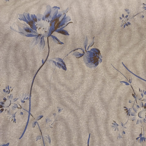  This beautiful cotton fabric is made in Japan. Super soft hand and lightweight feel, this fabric has big blue flowers on a tan background. This tan color has a little bit of a green tint to it. Beautiful fabric for clothing or quilting.