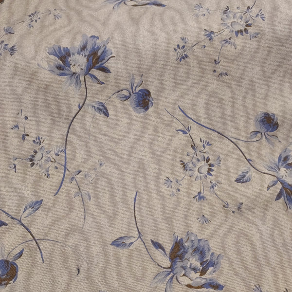  This beautiful cotton fabric is made in Japan. Super soft hand and lightweight feel, this fabric has big blue flowers on a tan background. This tan color has a little bit of a green tint to it. Beautiful fabric for clothing or quilting.