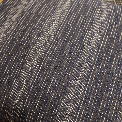 This beautiful woven fabric is made in Japan. Featuring a textured weave this fabric would make beautiful garments. This fabric has white woven through it as well as navy. Could work as top or bottom weight fabric.