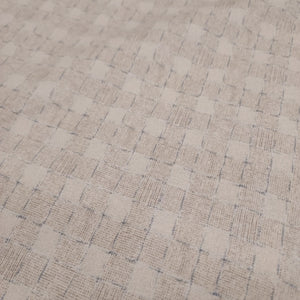 This beautiful cotton fabric is made in Japan. Soft hand and lightweight feel, this fabric has a light taupe background with a taupe and blue grid pattern on top. The grid pattern almost looks like a loose basket weave. This fabric is beautiful and would be suitable for quilting or apparel sewing.   Variant style (CE10472S-A)