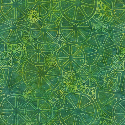 This batik is a lime green/yellow citrus print on top of a green background. There are many different sizes of citrus slices that make up this toss. 