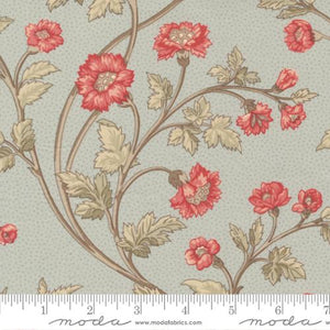 This fabric is covered in red flowers with green leaves over a light blue background. This fabric is a traditional design and has 2 other coordinating fabrics from the same collection.