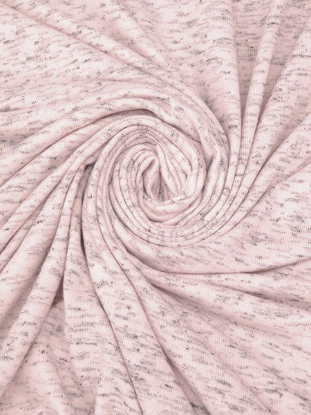 ﻿This is a misty rose colored heather brushed sweater knit that is 56" wide. It is a rayon, polyester, lycra blend. It has a 4 way stretch that is 70% selvage to selvage. It has a fuzzy hand and is super cozy. 