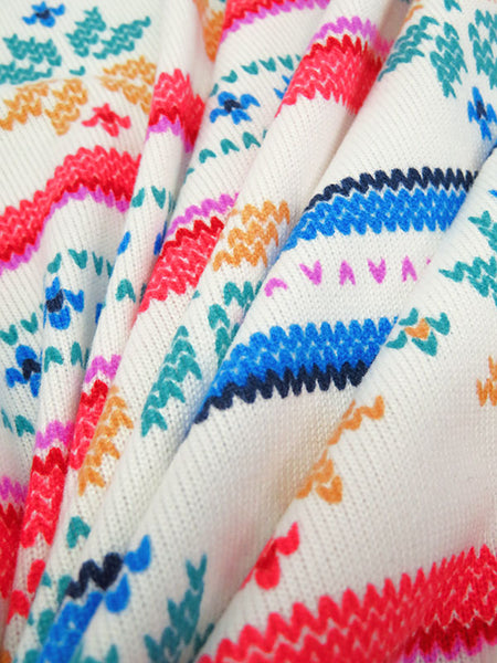 This fabric is perfect for some cozy pajamas! Horizontal snowflake stripe brushed sweater knit that is 62" wide. Bright colors with a fun design. Polyester/Lycra blend. Horizontal stripe is 9" vertical x 2" horizontal repeat. 4-way stretch 60% selvage to selvage. This fabric is a lighter weight fabric, so it falls closer to the body. Would be great for a matching pj set. 