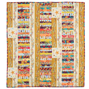 Here is Folk Art Baby made by Megan Manwaring.  Megan chose to play with the Stars and Stripes pattern and to make a coin style quilt using lots of strip scraps from other ranges.  The trailing string pieced vine inspired by Susan McCord works beautifully with so many fabrics and the result is fantastic.  I so often hear people say they need a quick baby quilt and this one hits the mark on so many levels.