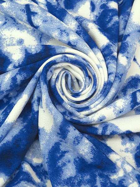 This vibrant fabric has a fun print and texture. Liverpool Double Knit. Textured Hand with a crepe texture. Polyester/Lycra blend. White, blue, dark cerulean and steel blue. Abstract Daub Print 26" Vertical Repeat. 4 way stretch - 40% selvage to selvage - 20% along selvage. Medium weight, falls moderately close to the body. 