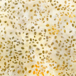 This batik is a beautiful brown and cream color. Cream background with tan and orange seeds. This is a great blender that is more of a neutral color palette. This fabric still has the dyed variation throughout which gives it that interest. 
