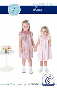The Children's Corner Bishop Newborn to 24 Months is the classic, raglan sleeved bishop with smocking around the neck. It falls just below the knee. The revised Bishop pattern inspired by the original Betsy, Gwen, and Ki Bishop patterns by Elizabeth Travis Johnson and includes 2 views that close in the back. View A has an easy self-faced placket with a seam up the center back. View B has a continuous bound placket and the back is cut on the fold.