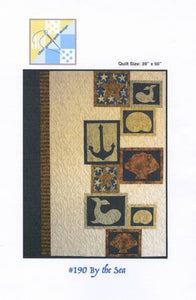 By the Sea uses the fabric line Captain's Anchor from the Island Batik, Inc., designed by Kathy Engle for Cheri Good Quilt Design. The modern 39in x 50in quilt is an asymmetrical design featuring large and small framed nautical shapes. A stepped arrangement of the appliqued shapes in a warm white background on the right side of the quilt is balanced with a striped border on the left side. Full-size templates for all of the appliques are included with a choice of needle-turn or fused applique methods.