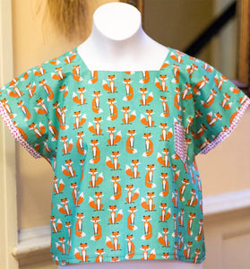 This pattern is an easy tunic top made from fat quarters! Add a contrasting fabric to the sleeves and pocket  for this project you will need -    - for up to 34" bust, 2 fat quarters or tee or 1/2yd of woven fabric  - for 35+ bust - 3/4yd woven fabric (you will refold and cut width-wise; choose non-directional prints)  - 1 contrasting fat quarter or 1/4yd woven fabric  - craft paper for pattern