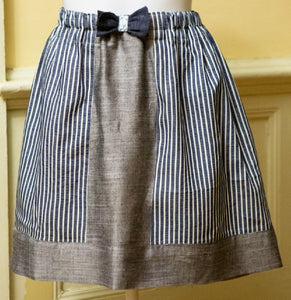 This pattern is an easy elastic waist skirt made from fat quarters! Add a bow for a little something extra.  for this project you will need -   2 fat quarters of main fabric  2 fat quarters of contrast fabric  one large safety pin  4 inches of 1/2" ribbon  1 yard 3/4" elastic