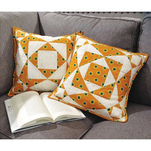 Ready to take a step forward in your quilt-ability? It's time to make some pillows! The Cut Loose Press Storm at Sea Pillow Pattern is a perfect follow-up to your first projects. This pattern requires minimal time and material, making it ideal for quick-quilting and getting some practice in before you move on to more intricate work. Complete this project using the Creative Grids Two Peaks in One and Square on Square 8" trimming tools (not included).