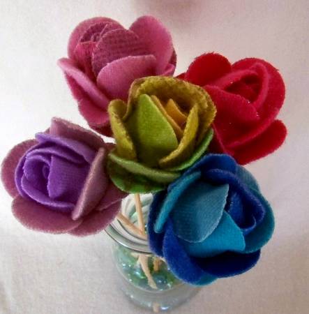 Cut Loose Press Wooly Roses Pattern  Finished Project Dimensions: 2in x 2-1/2in  Project Time: -2 Hours  Fabric Type: Felt  You will need felt scraps, wooden skewers, hot glue, and styrofoam balls!  You'll need   - glue gun  - hot glue sticks  - bamboo skewers