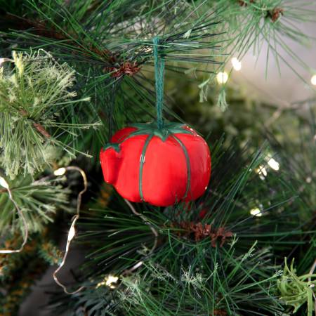Add a touch of nostalgia to your holiday décor with the iconic Dritz Tomato Pin Cushion transformed into a collectible ornament – so charming, you will want to keep it on display year-round! Ideal for gift-giving and as stocking stuffers for sewing and quilting enthusiasts. Realistic pin cushion design in handcrafted ceramic. Giftable box. Proprietary Dritz edition.