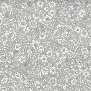 This soft grey floral fabric is covered in white flowers over a smoky grey background. Printed in Japan, this cotton would make a beautiful blouse or dress - Even great for quilting! 100% cotton, 44" wide