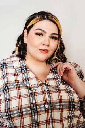 The Patina Blouse is a collared, v-neck, button up top. The sleeves are full and the pattern includes options for a short sleeve or long sleeve with cuff and continuous bound placket.
