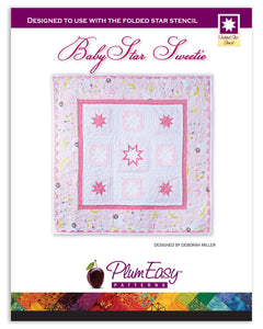 Baby Star Sweetie is our first published pattern exclusively for use with our Folded Star Stencil tool (PEP205). The quilt is full of stars that seem to float in a background of white, with different size star blocks that are made from prairie point triangles. The middle star has a double set of prairie points. The edges are trimmed with jumbo rick rack. These combine to make a darling baby quilt. The Folded Star Stencil has 48 and 90 degree angles for positioning your prairie points into perfect stars.