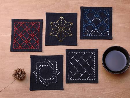 Japanese traditional stitching technique, which is very easy to learn. Its stitching lines make simple and beautiful patterns on the cloth. This contains a 6in x 26.5in cloth with designs for 5 coasters. The finished size of each coaster is 4in x 4in. Printed in Japanese.