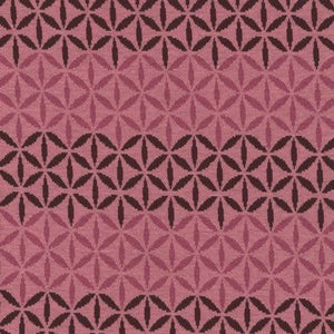 Avalana Jacquard by Stof. Pink flowers and graphics. This super soft knit would make a great sweater! Pretty rose pink as the background and maroon and hot pink design. 