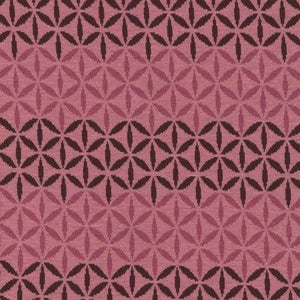 Avalana Jacquard by Stof. Pink flowers and graphics. This super soft knit would make a great sweater! Pretty rose pink as the background and maroon and hot pink design. 