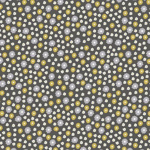 AVALANA Jersey Prints by Stof. Knit Jersey, organic. Small light grey, yellow, and cream flowers on grey ground.