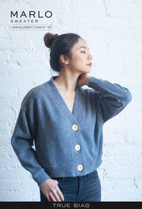 The Marlo pattern is an oversized sweater with a dropped shoulder, deep V-neck, wide bands and large buttons. View A is cropped length. View B has patch pockets and hits above midthigh.  Printed Paper Pattern Finished Size 0-18 Final Product: Wearables Technique Used: Standard Machine Sewing Skill Level: Confident Beginner