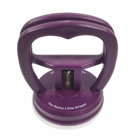 The Little Gypsy Gripper is designed with a suction cup that attaches to any smooth ruler or template surface. The Gripper ensures complete control of your small rulers and templates, and keeps your fingers out of harm’s way - making this a must have for any new or young quilter! 