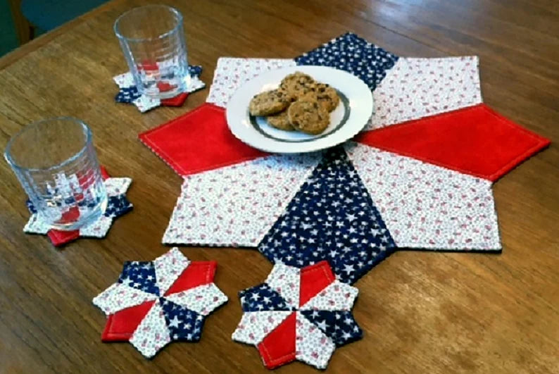 Super Stars pattern is a festive addition to your holiday table. Use two or three fat quarters plus a backing fabric to make this set of four 5-inch coasters and a 20-inch table topper. 