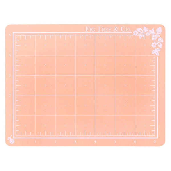 This sweet double-sided cutting mat by Fig Tree Quilts will make cutting a breeze and spruce up your sewing room! The measurement markings go up to 5in x 7in and the self-healing mat is strong and durable. Mat size is 6" x 8" (15.5cm x 20.5cm) Do not iron mat, or apply heat.